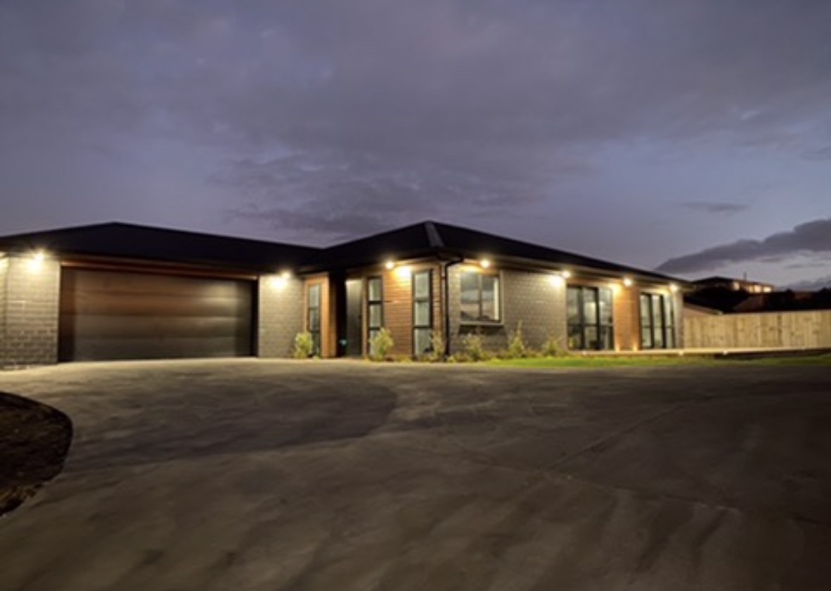 New build exterior lighting showing soffit downlights and entrance lighting by Boyd Electrical Whanganui